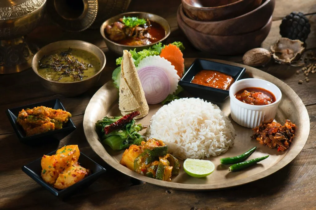 Nepalese Cuisine - <a href="https://unsplash.com/photos/5Q-7kgG7xbo?utm_source=unsplash&utm_medium=referral&utm_content=creditCopyText">Photo Source</a>