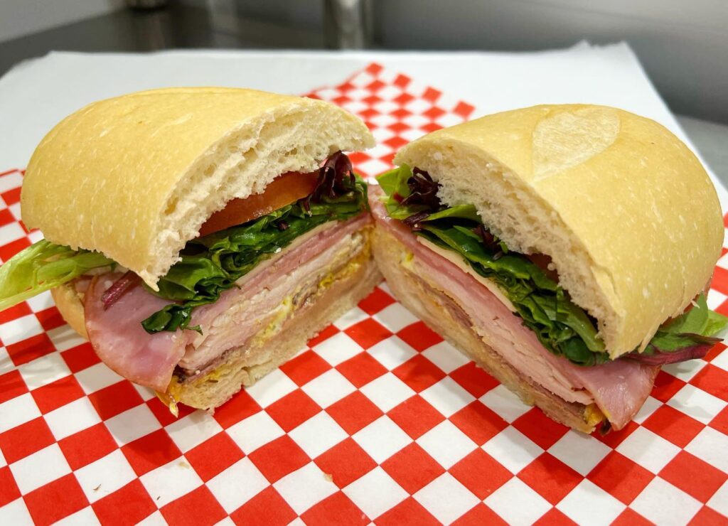 The Sandwich Spot - <a href="https://www.facebook.com/photo/?fbid=163421949843726&set=a.136802302505691">Photo Source</a>