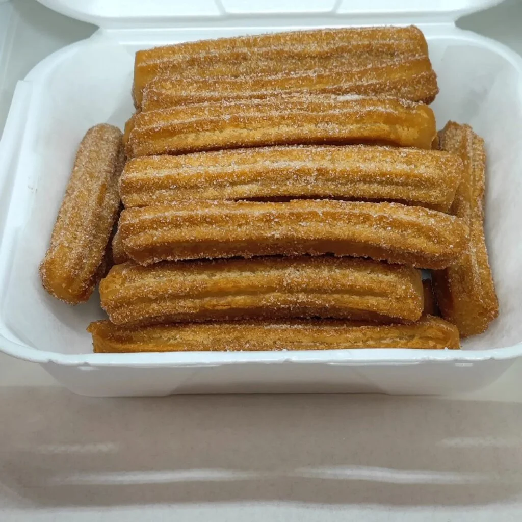 Cajeta Churro Cafe - <a href="https://www.facebook.com/photo/?fbid=852481159477088&set=pb.100063635987587.-2207520000.">Photo Source</a>